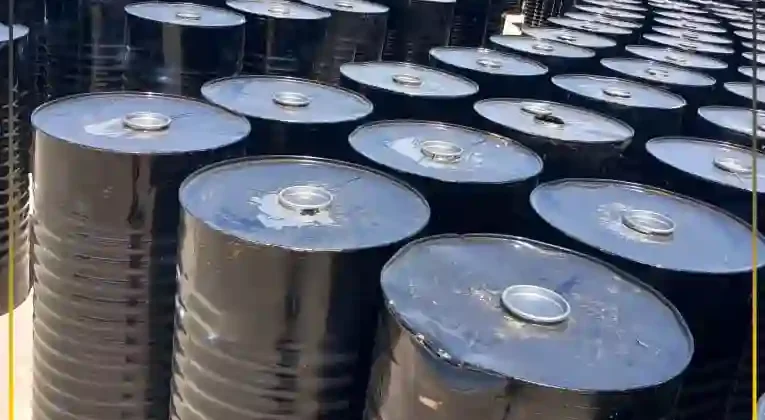Industrial steel drums of polymer modified bitumen stored for high-performance road projects