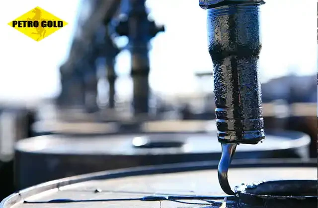 Viscous liquid bitumen filling steel drums at a refinery showcasing the optimal physical properties suitable for industrial use